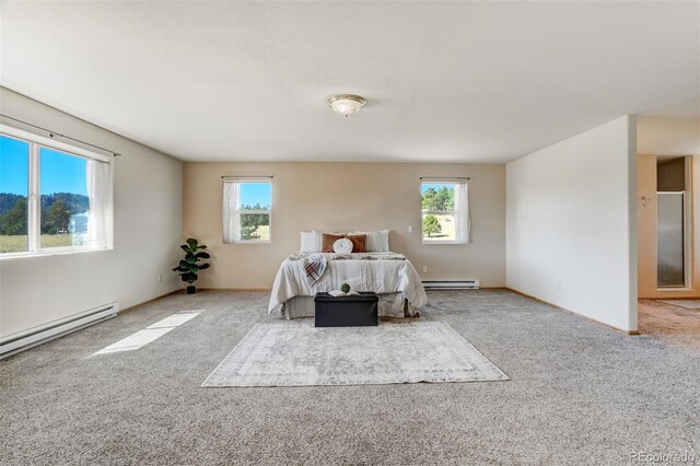 bedroom with light colored carpet and baseboard heating