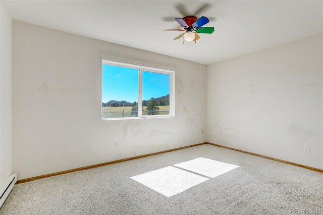 empty room with light colored carpet, ceiling fan, and a baseboard heating unit