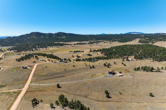 drone / aerial view with a mountain view and a rural view