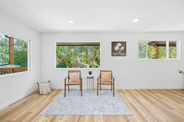 261 Knox Ct, Denver, CO 80219 - sitting room with wood finished floors and recessed lighting