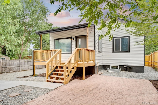 261 Knox Ct, Denver, CO 80219 - view of front facade featuring a fenced backyard and a deck