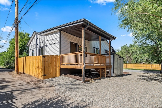261 Knox Ct, Denver, CO 80219 - view of front facade featuring a wooden deck