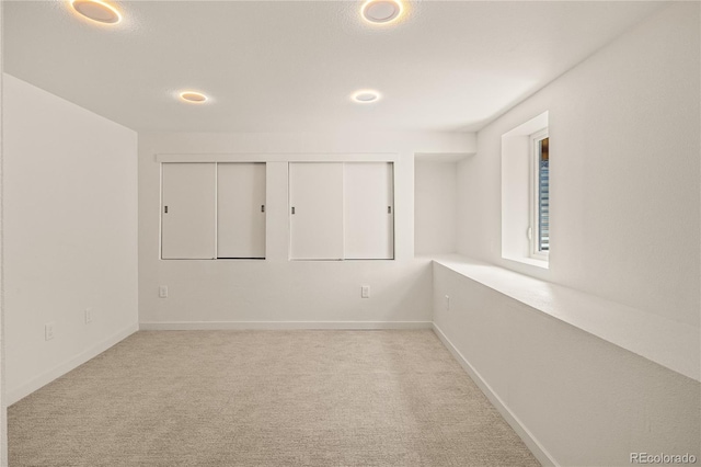 261 Knox Ct, Denver, CO 80219 - carpeted empty room with recessed lighting