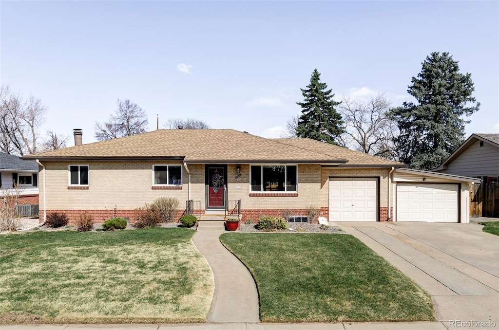5010 S Elati St, Englewood, CO 80110 - single story home featuring brick siding, a garage, concrete driveway, and a front yard