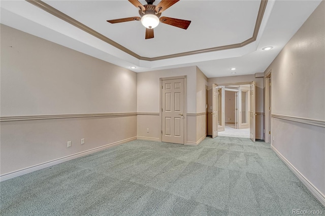 16150 Cliffrock Ct, Colorado Springs, CO 80921 - empty room featuring a raised ceiling, ceiling fan, light carpet, recessed lighting, and ornamental molding