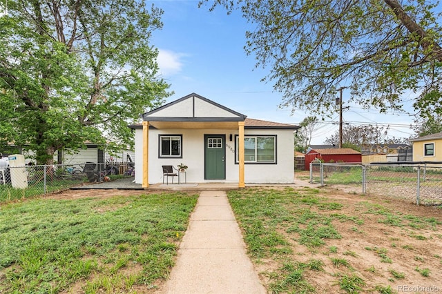 6980 Niagara St, Commerce City, CO 80022 - bungalow-style house featuring stucco siding and a porch