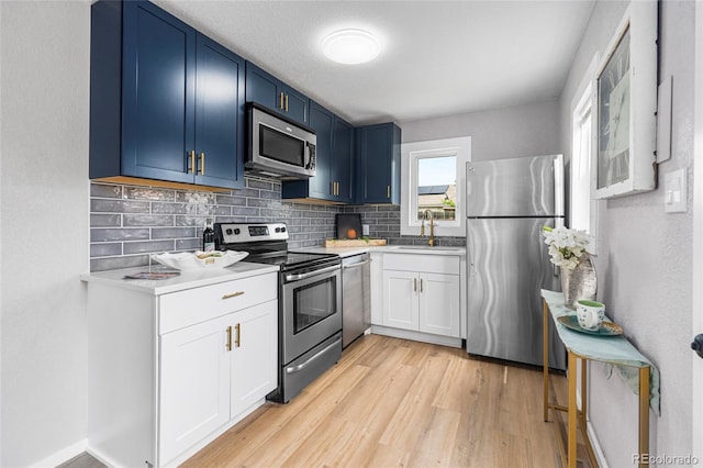 6980 Niagara St, Commerce City, CO 80022 - kitchen featuring appliances with stainless steel finishes, a sink, backsplash, and light countertops