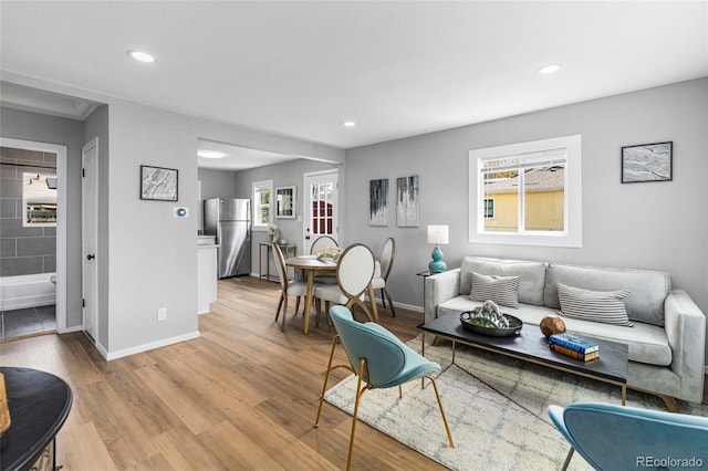 6980 Niagara St, Commerce City, CO 80022 - living area with recessed lighting, baseboards, and light wood finished floors