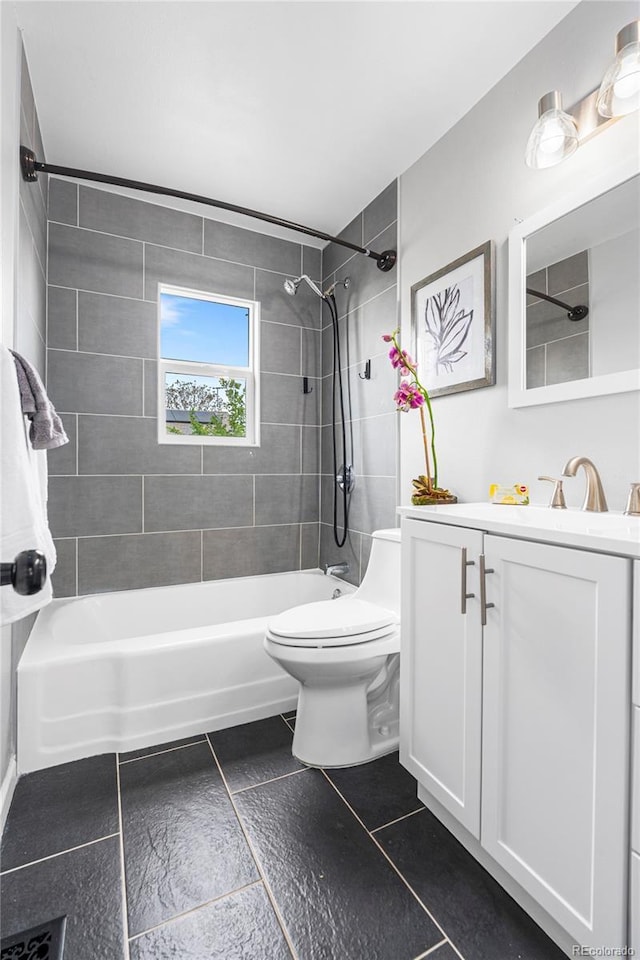 6980 Niagara St, Commerce City, CO 80022 - bathroom featuring toilet, bathtub / shower combination, vanity, and tile patterned flooring