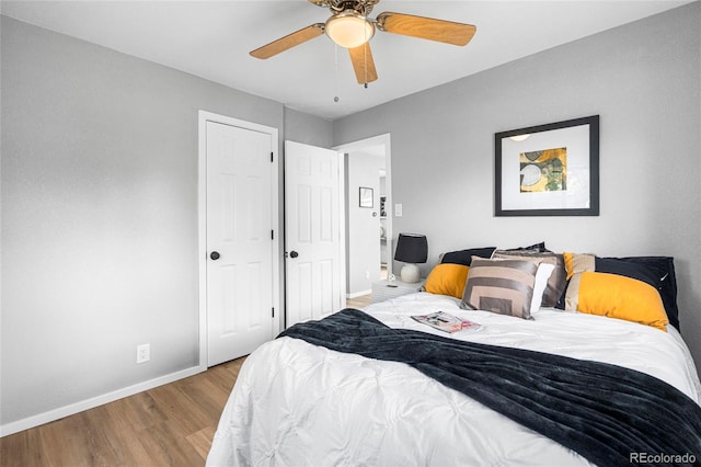 6980 Niagara St, Commerce City, CO 80022 - bedroom with baseboards, wood finished floors, and ceiling fan