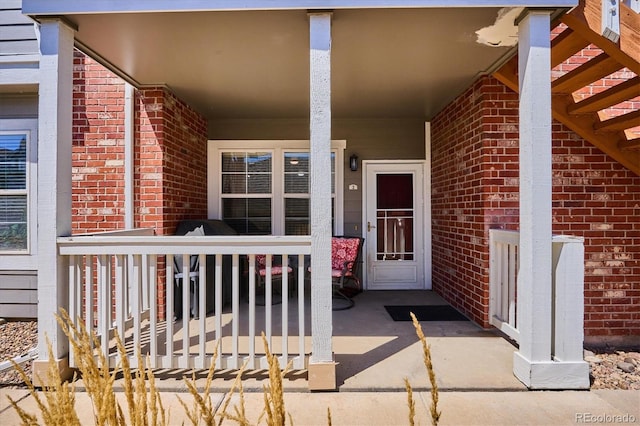 doorway to property with a porch