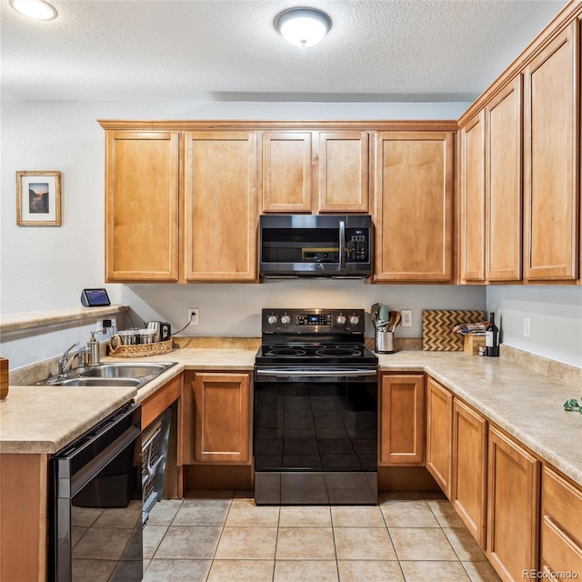 kitchen with dishwashing machine, black range with electric stovetop, sink, and a textured ceiling