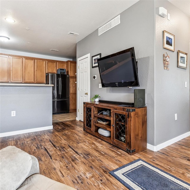 living room with dark wood-type flooring