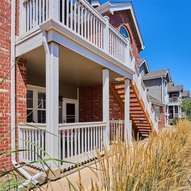 view of side of home with a balcony