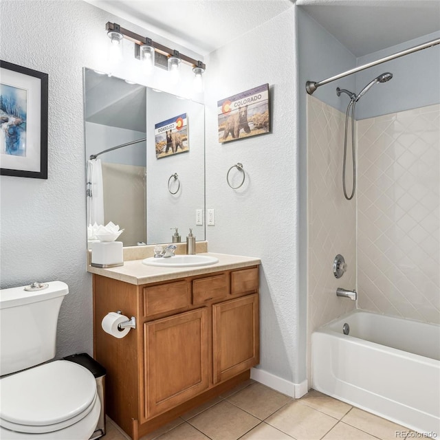 full bathroom with tiled shower / bath combo, vanity, tile patterned floors, and toilet