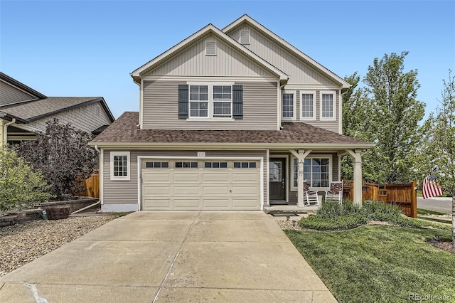 2115 Coach House Loop, Castle Rock, CO 80109 - traditional home featuring a porch, concrete driveway, an attached garage, and a shingled roof