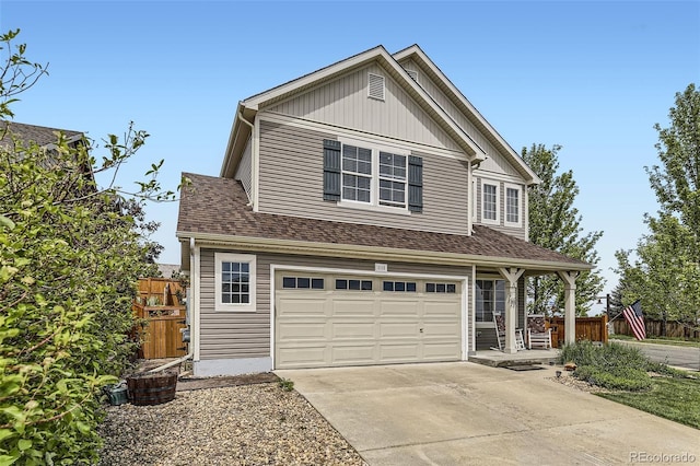 2115 Coach House Loop, Castle Rock, CO 80109 - traditional home featuring an attached garage, driveway, and a shingled roof