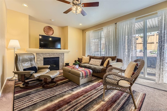 2115 Coach House Loop, Castle Rock, CO 80109 - living room featuring carpet floors, a ceiling fan, a tiled fireplace, baseboards, and recessed lighting