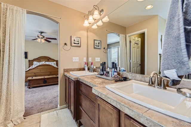 2115 Coach House Loop, Castle Rock, CO 80109 - bathroom with connected bathroom, a ceiling fan, double vanity, tile patterned floors, and recessed lighting