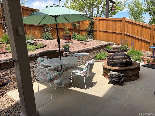 2115 Coach House Loop, Castle Rock, CO 80109 - view of patio featuring an outdoor fire pit and outdoor dining space