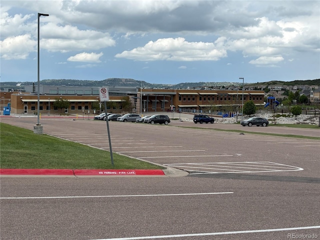 2115 Coach House Loop, Castle Rock, CO 80109 - uncovered parking lot with a mountain view