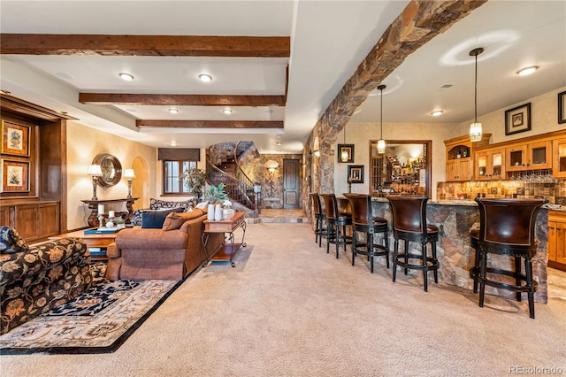 living room with light carpet and bar area