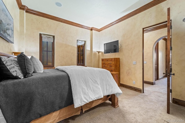 bedroom with carpet floors and crown molding