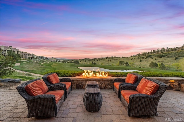 patio terrace at dusk with an outdoor fire pit