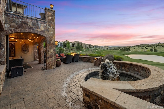 view of patio terrace at dusk