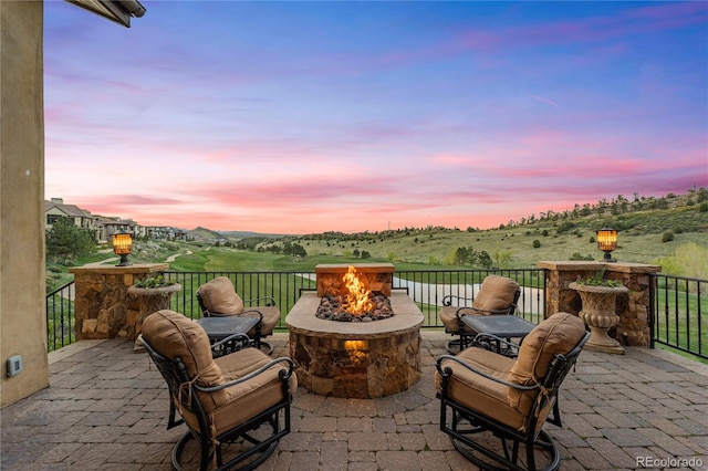 patio terrace at dusk with an outdoor fire pit