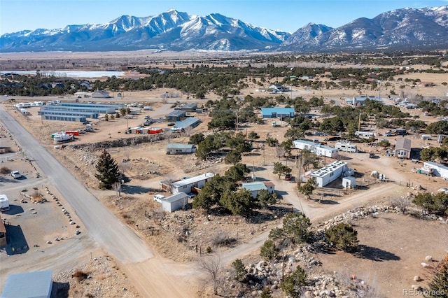 aerial view featuring a desert view and a mountain view