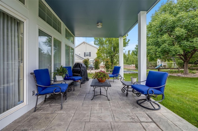 view of patio / terrace featuring grilling area and a playground