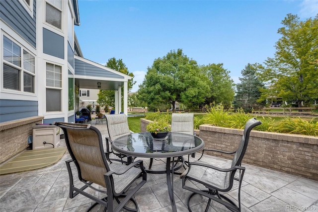 view of patio featuring outdoor dining area