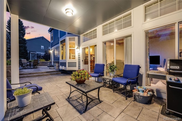 patio terrace at dusk with outdoor dining area