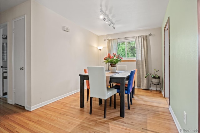 8481 E Briarwood Blvd, Centennial, CO 80112 - dining space with light wood-style floors and rail lighting