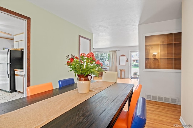 8481 E Briarwood Blvd, Centennial, CO 80112 - dining room with light wood-type flooring and baseboards