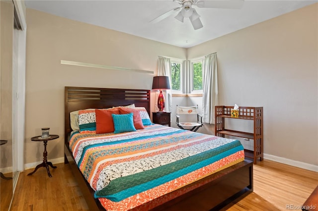 8481 E Briarwood Blvd, Centennial, CO 80112 - bedroom with wood finished floors and a ceiling fan