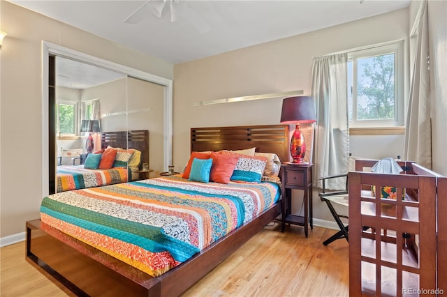 8481 E Briarwood Blvd, Centennial, CO 80112 - bedroom with wood finished floors, a closet, and a ceiling fan
