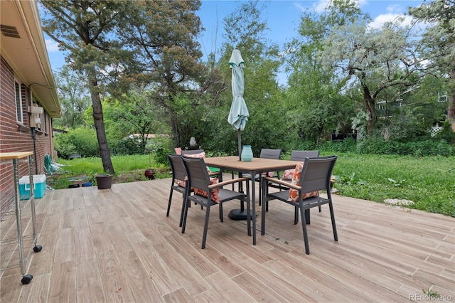 8481 E Briarwood Blvd, Centennial, CO 80112 - wooden deck with outdoor dining area and view of scattered trees
