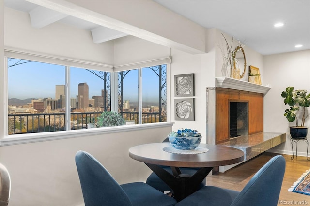 1200 N Humboldt St Unit 1003, Denver, CO 80218 - dining area featuring wood finished floors, plenty of natural light, recessed lighting, beamed ceiling, and a view of skyline
