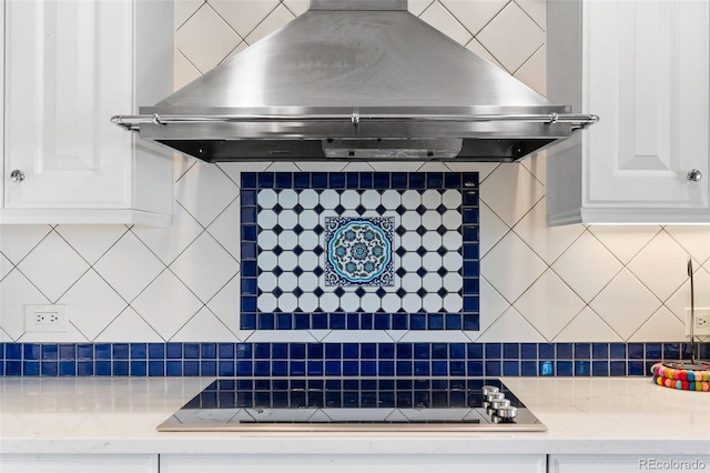 1200 N Humboldt St Unit 1003, Denver, CO 80218 - kitchen featuring extractor fan, tasteful backsplash, black electric stovetop, and white cabinetry