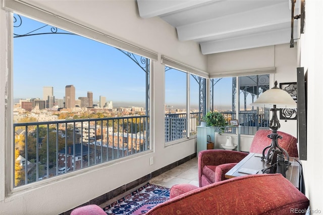 1200 N Humboldt St Unit 1003, Denver, CO 80218 - sunroom with a skyline view, beamed ceiling, tile patterned flooring, and baseboards
