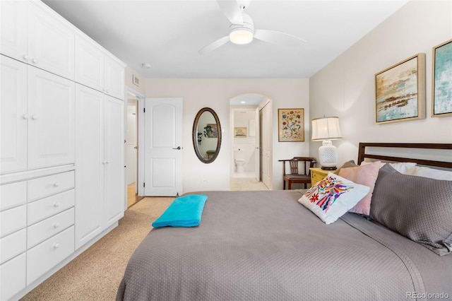 1200 N Humboldt St Unit 1003, Denver, CO 80218 - bedroom featuring light carpet, connected bathroom, and ceiling fan