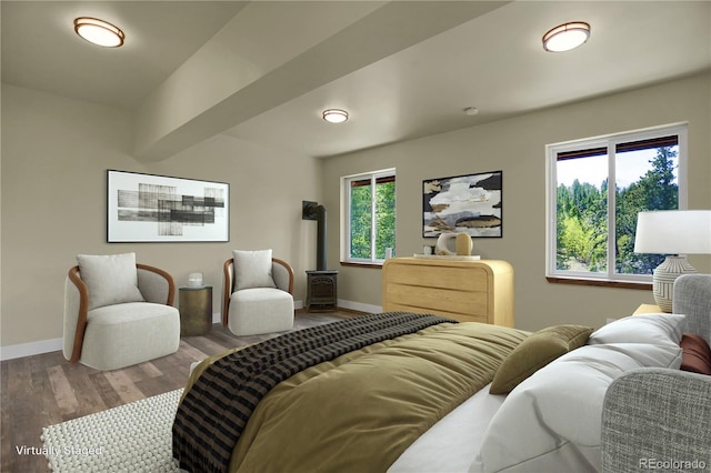 586 Alpine Way, Idaho Springs, CO 80452 - bedroom featuring wood finished floors and a wood stove