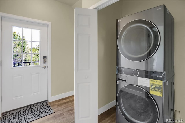 586 Alpine Way, Idaho Springs, CO 80452 - laundry area featuring stacked washer / drying machine and wood finished floors
