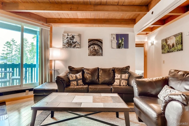 2300 Lodge Pole Cir Unit 103, Silverthorne, CO 80498 - living area with wood ceiling, healthy amount of natural light, beamed ceiling, and wood finished floors