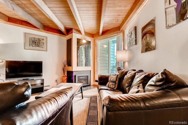 2300 Lodge Pole Cir Unit 103, Silverthorne, CO 80498 - living area with beamed ceiling, wooden ceiling, and a glass covered fireplace