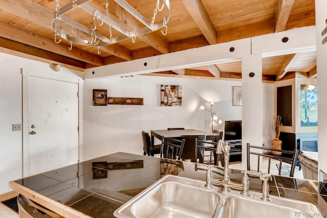 2300 Lodge Pole Cir Unit 103, Silverthorne, CO 80498 - kitchen with a sink, wood ceiling, and beamed ceiling