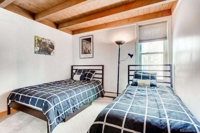 2300 Lodge Pole Cir Unit 103, Silverthorne, CO 80498 - bedroom with wooden ceiling, beamed ceiling, a baseboard heating unit, and carpet floors