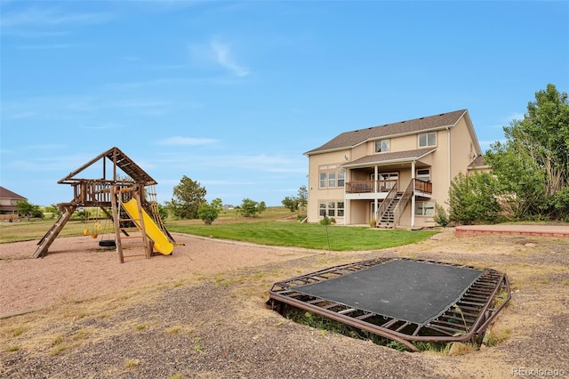 14825 Almstead St, Hudson, CO 80642 - view of jungle gym featuring a yard, stairway, and a deck